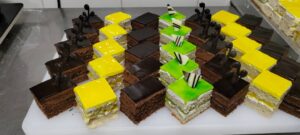 Pastry tray with colorful squared cake slices baked in Kigali Rwanda, perfect for breakfast or brunch.