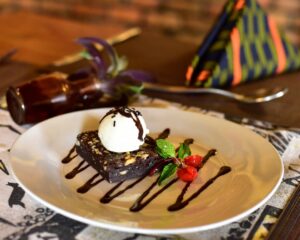 Signature brownies made by a local women’s bakery Rwanda, crafted with fair-trade ingredients topped with ice cream.