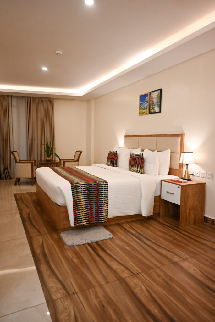 Modern Standard Room at The Hut Hotel Kigali with queen bed and city views.