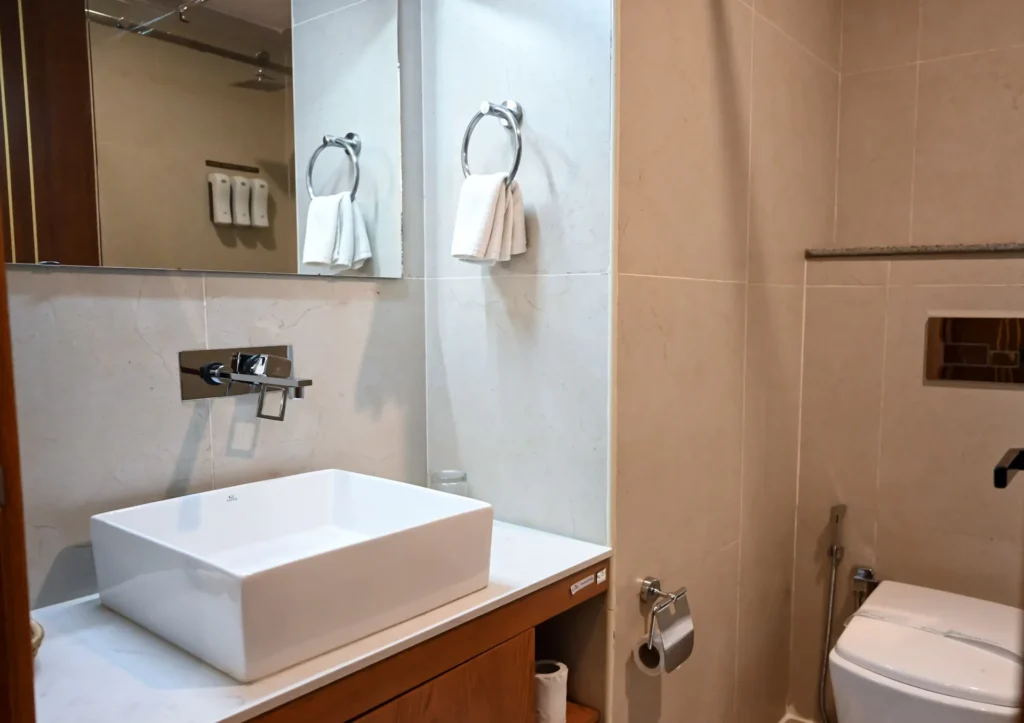 Modern guest bathroom with vessel basin at The Hut Hotel, Kigali
